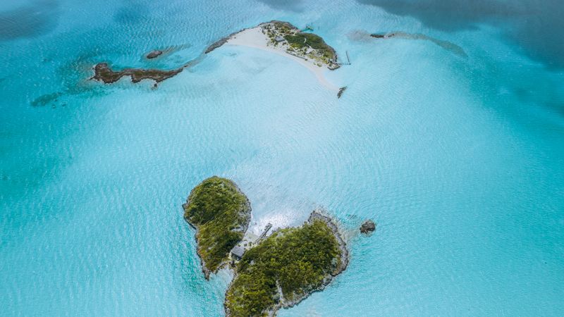Aerial view of green islands in turquoise Caribbean water
