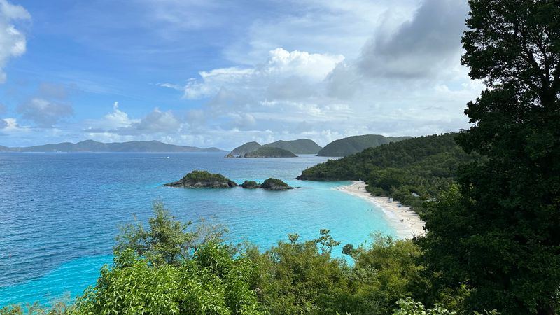 Tropical beach with lush green hills in the Virgin Islands